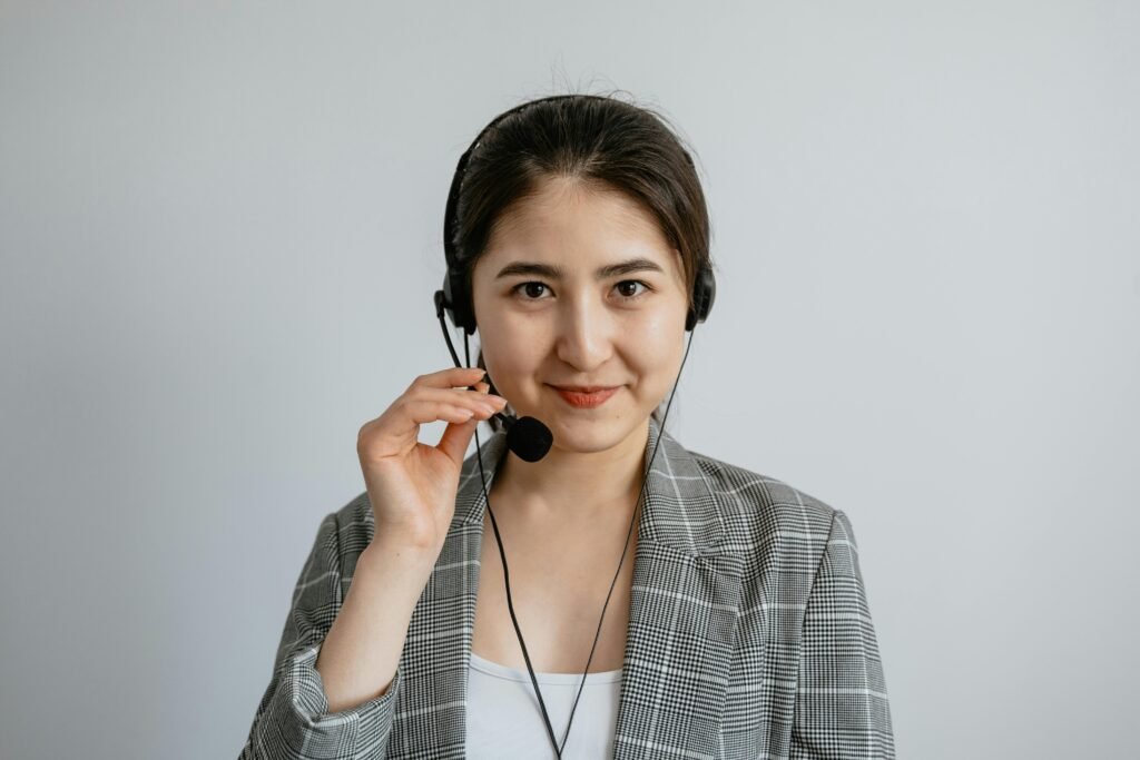 Portrait of a young call center agent confidently working with a headset.